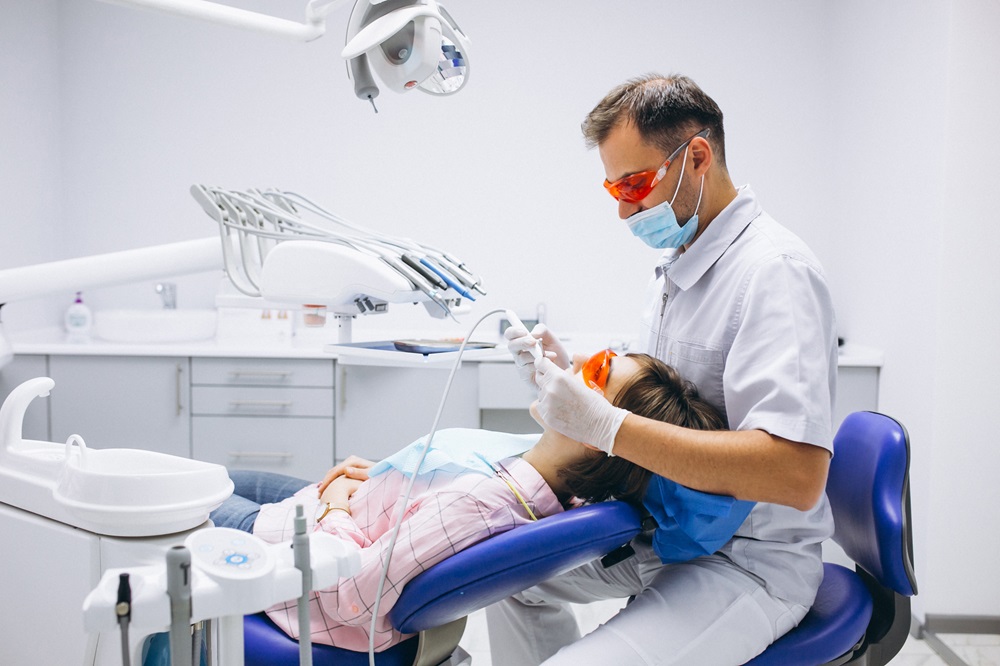 dentist performing dental cleaning